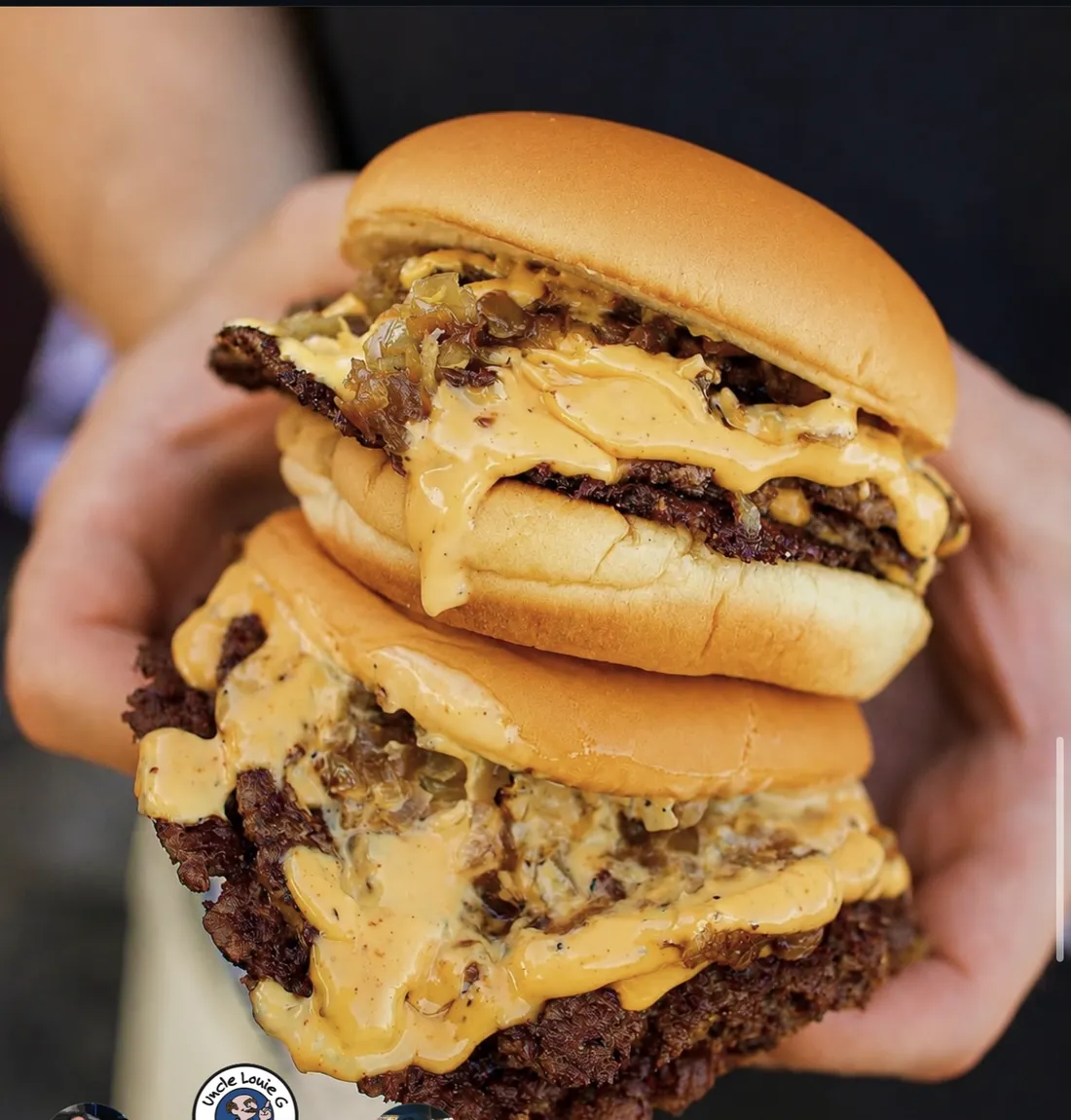 Two double smash burgers with melted cheese and smash sauce, the shop's own photograph
