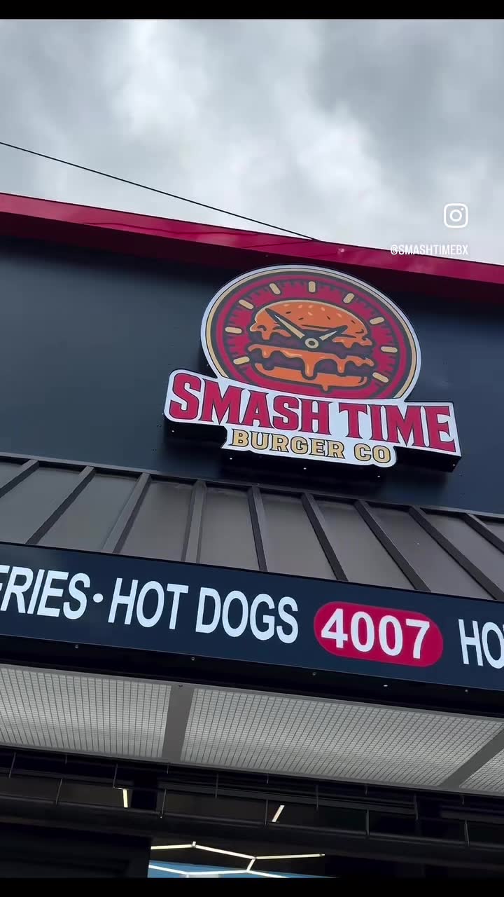 The shop from the street, the Smash Time sign above the door at 4007 East Tremont